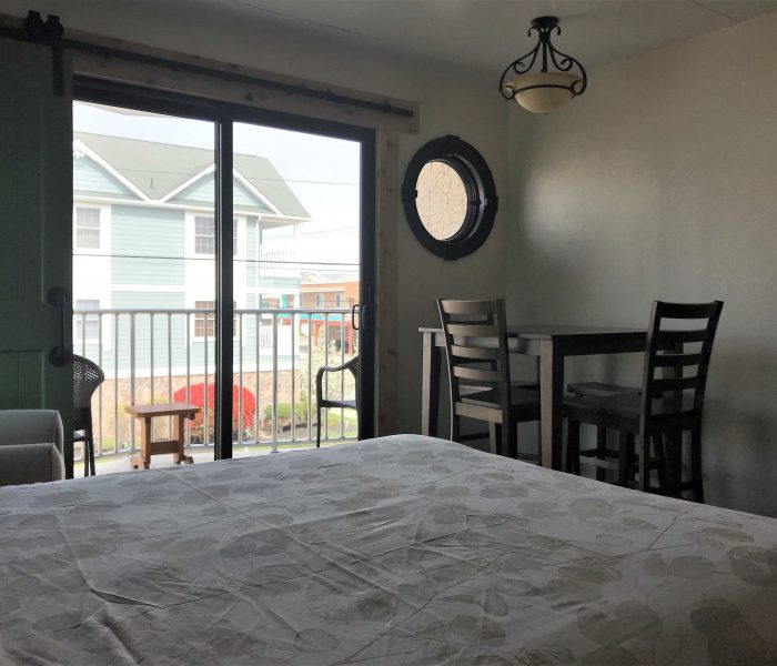 Ala Moana Motel suite A, dining table, new sliding glass doors, queen bed